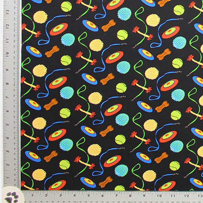 Colorful Dog Toys including Bumpy Balls, Tennis Balls, Fetch Sticks, and Frisbies Novelty fabric All Cotton, 44" wide, black background, images 1-1 1/2 inches