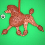 Hand-painted break-resistant acrylic resin dog Christmas ornament featuring a full-body Poodle-Standard-Red Dog in a gaiting pose, designed to hang on a tree or stand for display.
