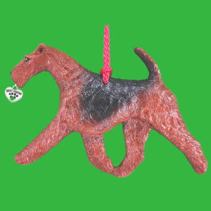 Hand-painted break-resistant acrylic resin dog Christmas ornament featuring a full-body Airedale Terrier in a gaiting pose, designed to hang on a tree or stand for display.