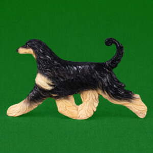 Hand-painted break-resistant acrylic resin dog magnet featuring a full-body Afghan-Hound-Black-and-Tan in a gaiting pose, designed to attach to metal surfaces.