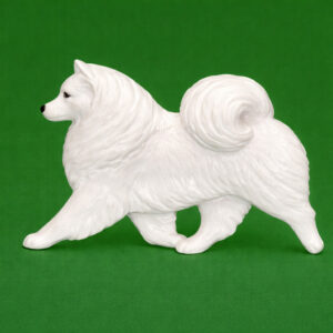 Hand-painted break-resistant acrylic resin dog magnet featuring a full-body American-Eskimo in a gaiting pose, designed to attach to metal surfaces.