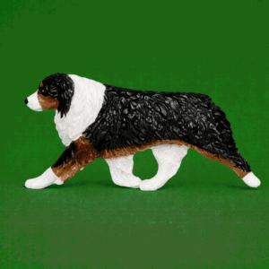 Hand-painted break-resistant acrylic resin dog magnet featuring a full-body Australian-Shepherd Black Tri in a gaiting pose, designed to attach to metal surfaces.