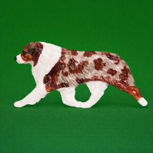 Hand-painted break-resistant acrylic resin dog magnet featuring a full-body Australian Shepherd Red Merle in a gaiting pose, designed to attach to metal surfaces.