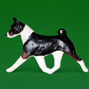 Hand-painted break-resistant acrylic resin dog magnet featuring a full-body Basenji Tri Colored in a gaiting pose, designed to attach to metal surfaces.
