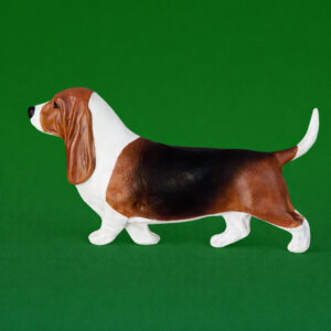 Hand-painted break-resistant acrylic resin dog magnet featuring a full-body Basset Hound in a gaiting pose, designed to attach to metal surfaces.