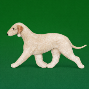 Hand-painted break-resistant acrylic resin dog magnet featuring a full-body Bedlington Terrier Sandy in a gaiting pose, designed to attach to metal surfaces.