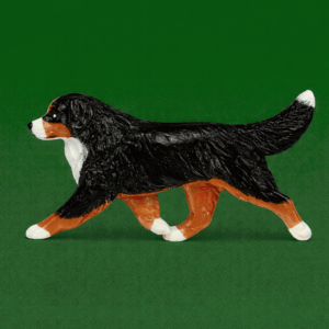 Hand-painted break-resistant acrylic resin dog magnet featuring a full-body Bernese Mountain Dog in a gaiting pose, designed to attach to metal surfaces.