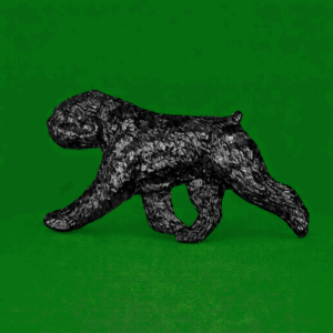 Hand-painted break-resistant acrylic resin dog magnet featuring a full-body Bouvier-des-Flandre Black in a gaiting pose, designed to attach to metal surfaces.