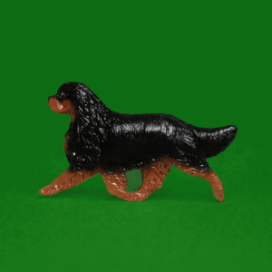 Hand-painted break-resistant acrylic resin dog magnet featuring a full-body Cavalier Black and Tan in a gaiting pose, designed to attach to metal surfaces.