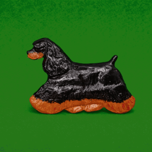 Hand-painted break-resistant acrylic resin dog magnet featuring a full-body Cocker-Spaniel-American-Black and Tan in a gaiting pose, designed to attach to metal surfaces.