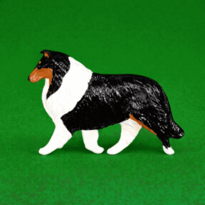 Hand-painted break-resistant acrylic resin dog magnet featuring a full-body Collie-Rough Tri in a gaiting pose, designed to attach to metal surfaces.