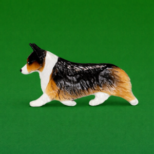 Hand-painted break-resistant acrylic resin dog magnet featuring a Corgi Pemi-Tri in a gaiting pose, designed to attach to metal surfaces.