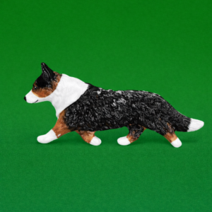 Hand-painted break-resistant acrylic resin dog magnet featuring a full-body Corgi-welsh-cardigan Tri in a gaiting pose, designed to attach to metal surfaces.