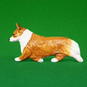 Hand-painted break-resistant acrylic resin dog magnet featuring a full-body Corgi-welsh-Pembroke Red and White in a gaiting pose, designed to attach to metal surfaces.