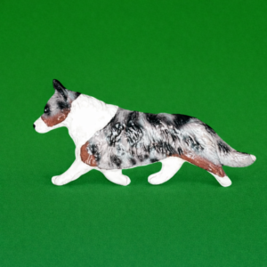 Hand-painted break-resistant acrylic resin dog magnet featuring a full-body Corgi-welsh-cardigan blue Merel in a gaiting pose, designed to attach to metal surfaces.