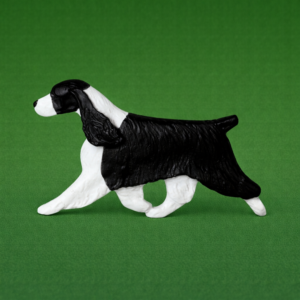 Hand-painted break-resistant acrylic resin dog magnet featuring a full-body English-Springer-Spaniel in a gaiting pose, designed to attach to metal surfaces.